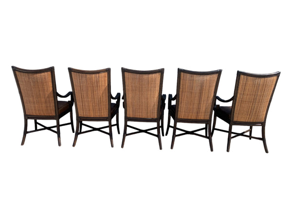 Palecek bamboo / woven bamboo back dining chairs leather seat and scrolled arms.